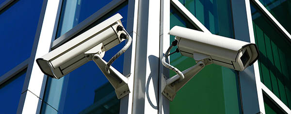 bigstock_Two_Security_Cameras_On_Glass_600x235